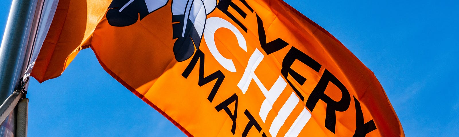 An orange Every Child Matters flag.