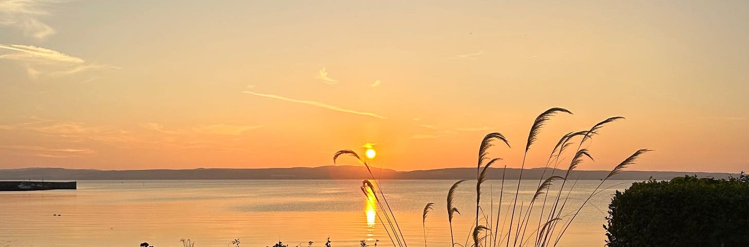 A vivid orange sunset over Bowmore, Islay