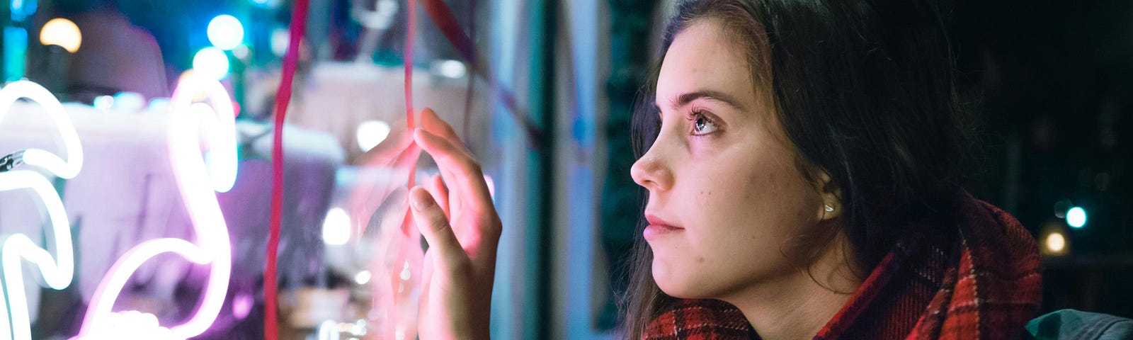 Girl looking at a window display in amazement.