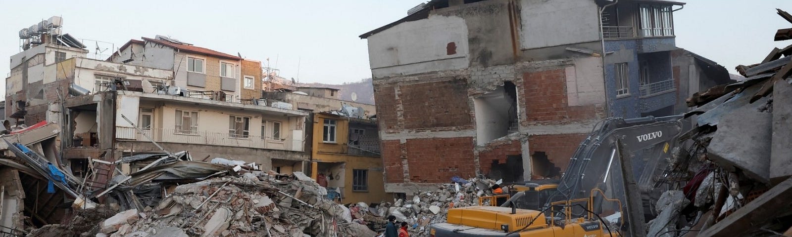 People work at the site of a collapsed building, in the aftermath of a deadly earthquake in Hatay, Turkey, February 14, 2023. Photo by Clodagh Kilcoyne/Reuters