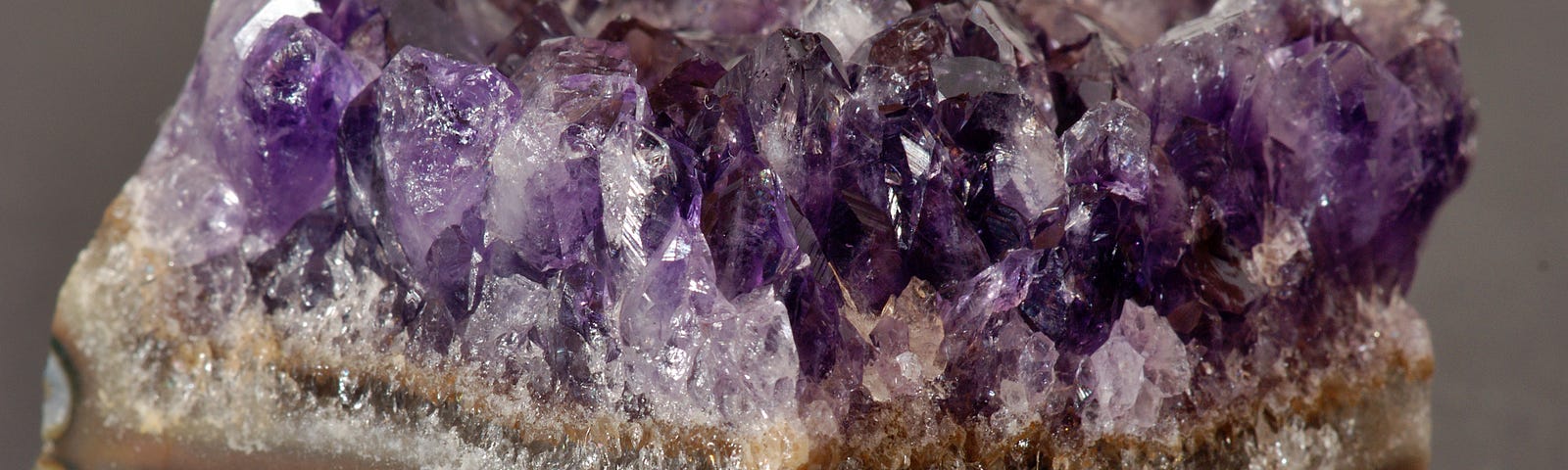 a purple gem stone is displayed