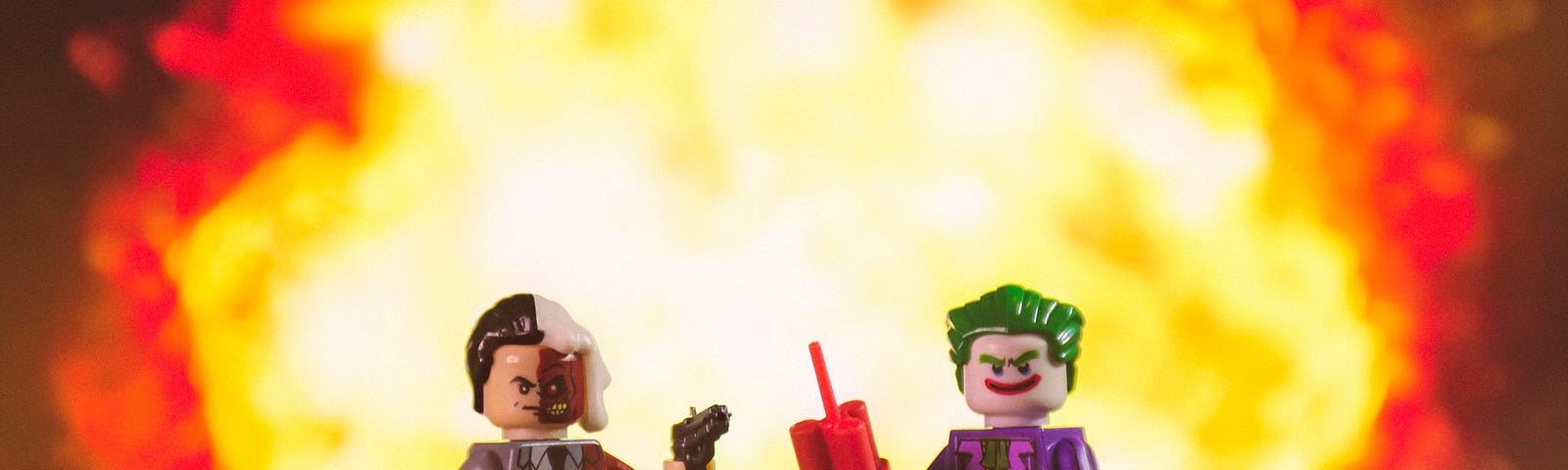 Two lego villains stand in front of an explosion