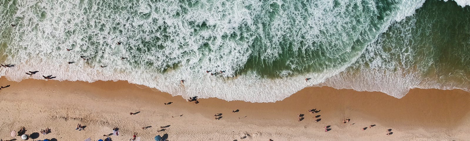 Umbrellas crowding a European beach