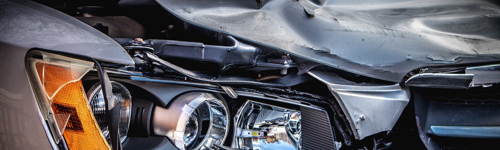 The wrecked front end of a car.