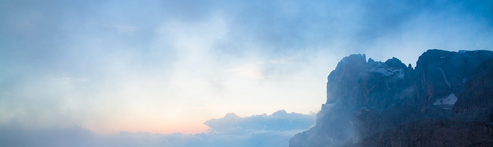 A man wandering in front of beautiful scenery