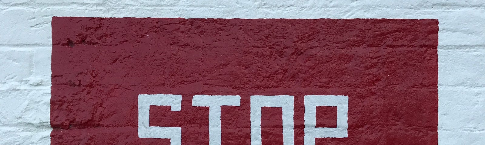 A red rectangle with the word “Stop” written in blocky white letters.