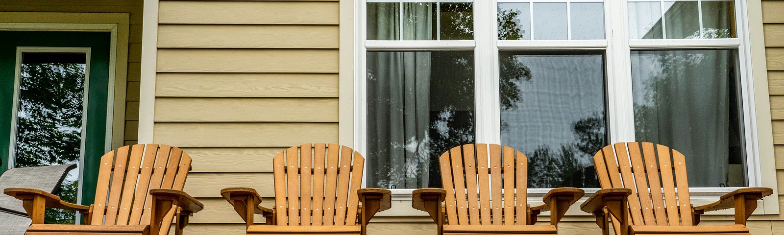 four chairs on a porch