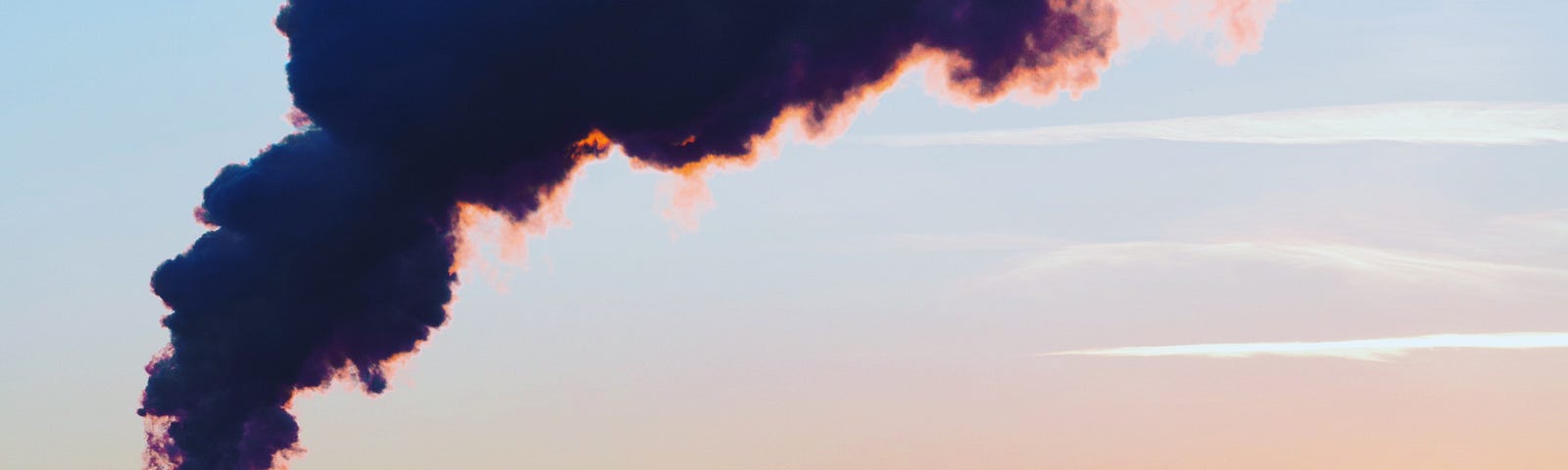 A factory spews air pollution as the sun sets in the background. Atmospheric fine particulate matter pollution around homes and workplaces increases breast cancer risk. We have a new breast cancer risk factor, according to research presented at the European Society of Medical Oncology (ESMO) 2023 Congress.