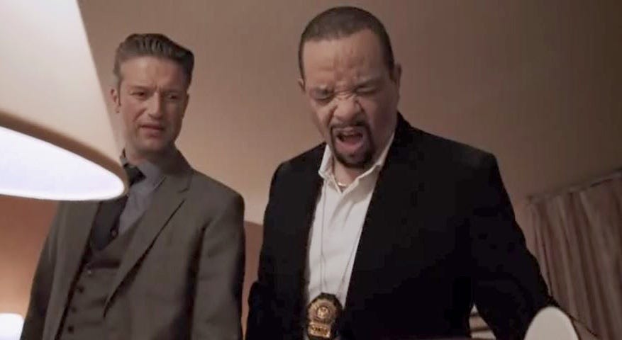 Detectives Carisi and Tutuola look in an ice bucket in a hotel room
