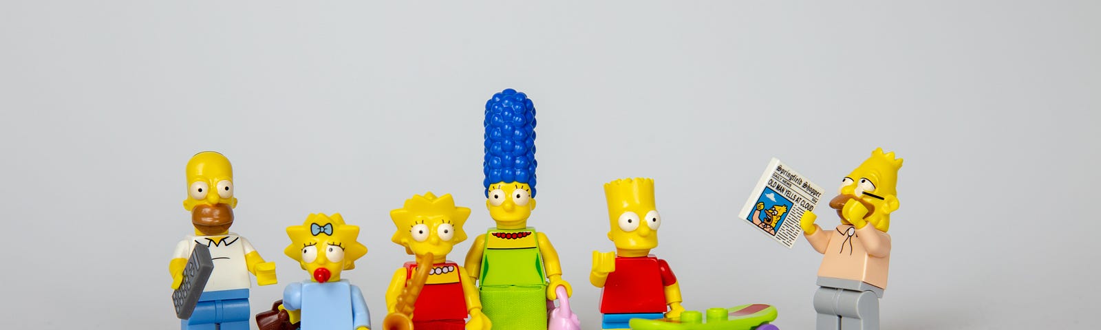 Lego plastic figurines of the cartoon Homer Simpson family
