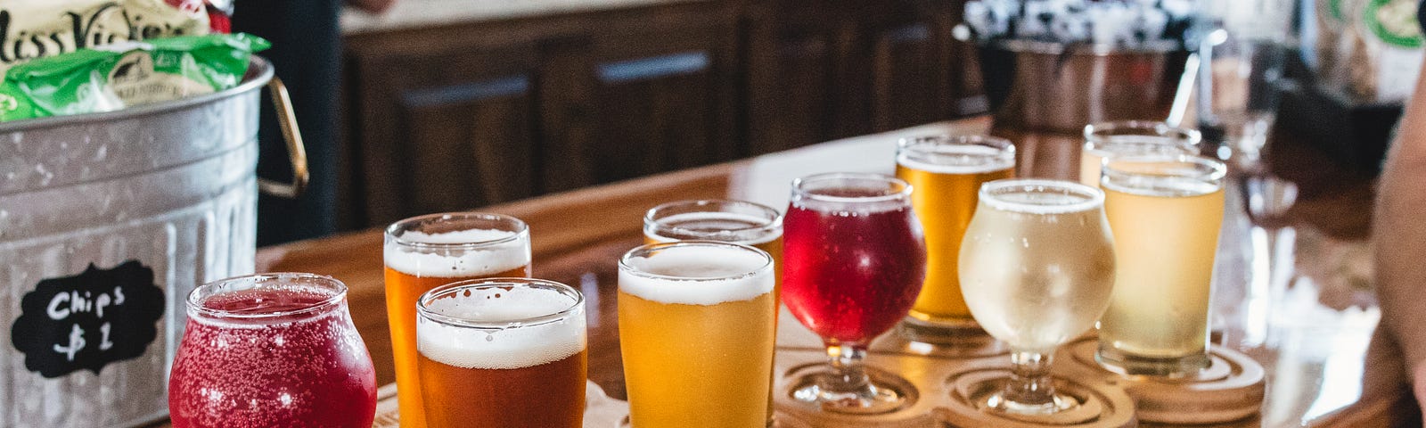 Different colors of beers in a different shape of glass. Nicely decorated brewery.