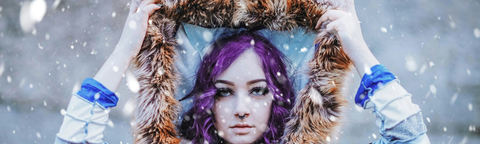 Young girl with purple hair and serious face pulling up her head covering to shelter from the rain and snow