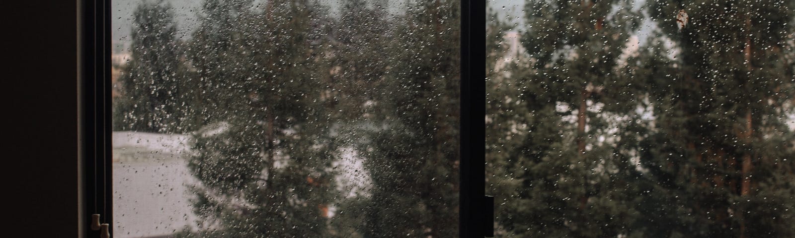 Here is a picture, looking out through a window and seeing the rain, representing a time of reflection of past difficulties and hope for a better tomorrow.