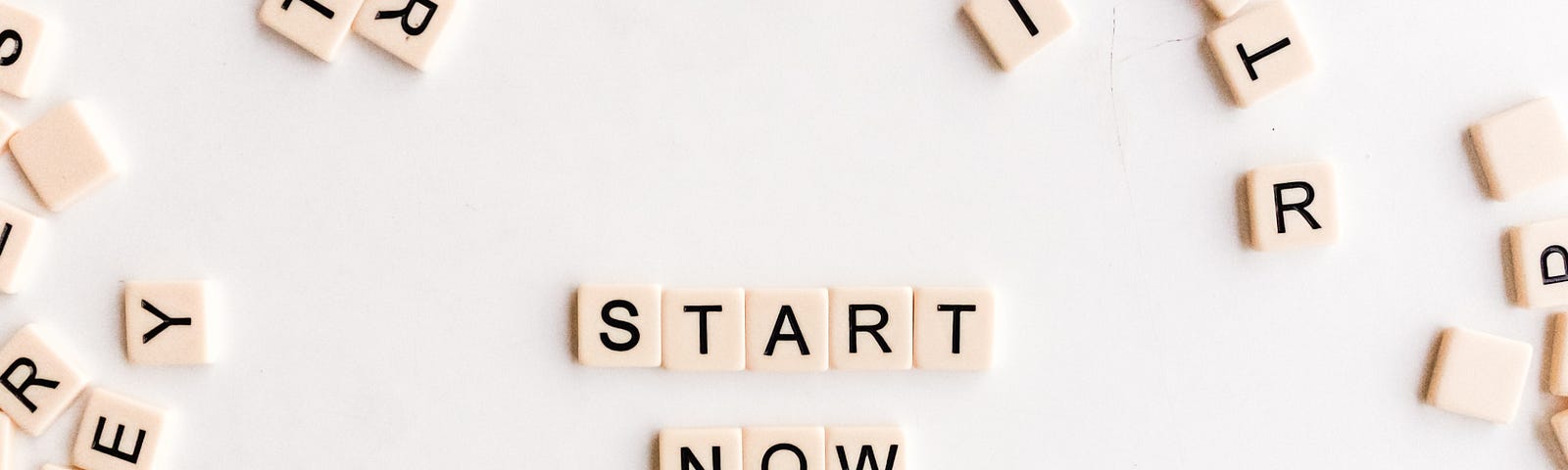 Scrabble letters spell “Start Now”