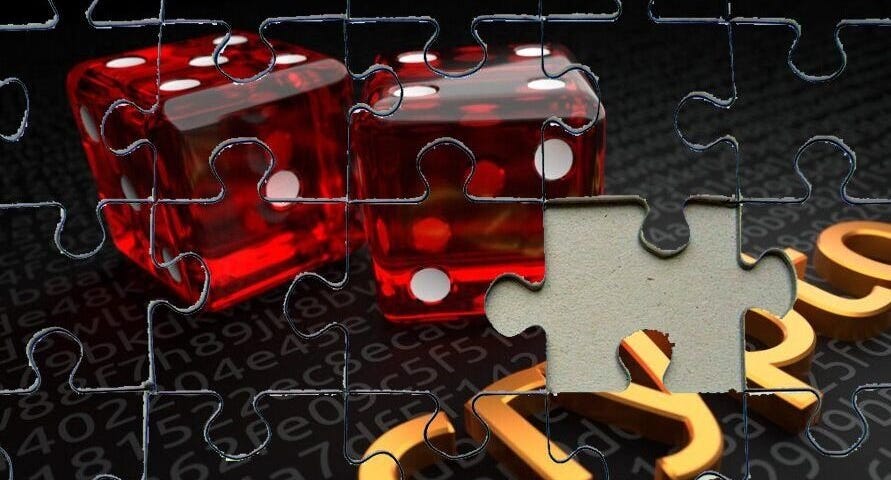 Two red dice on a black setting, the word crypto written with golden letters. The image was modified to look like a jigsaw puzzle.