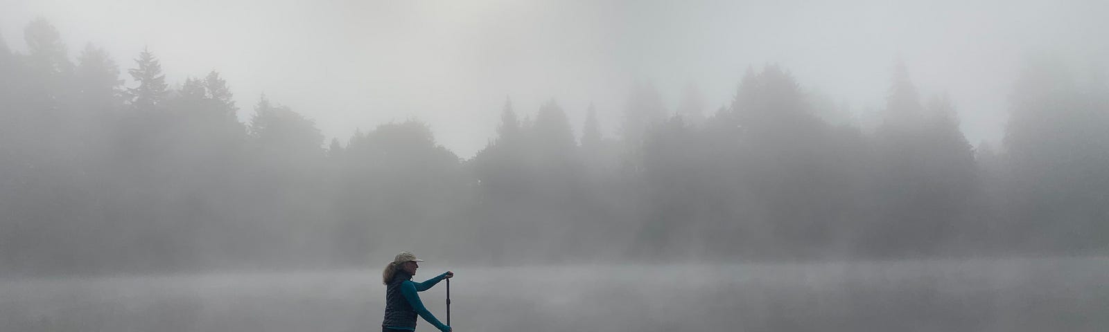 A man standup paddleboarding