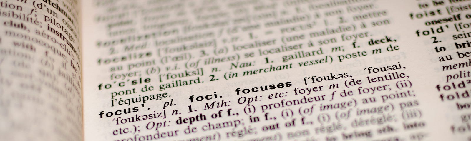 A picture of a dictionary with letters f, showing the word focus clearly.