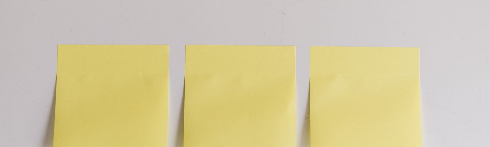 Image of three post-it notes and a pen underneath