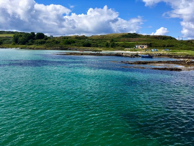 Emerald waters of Gigha and a wooden activity centre