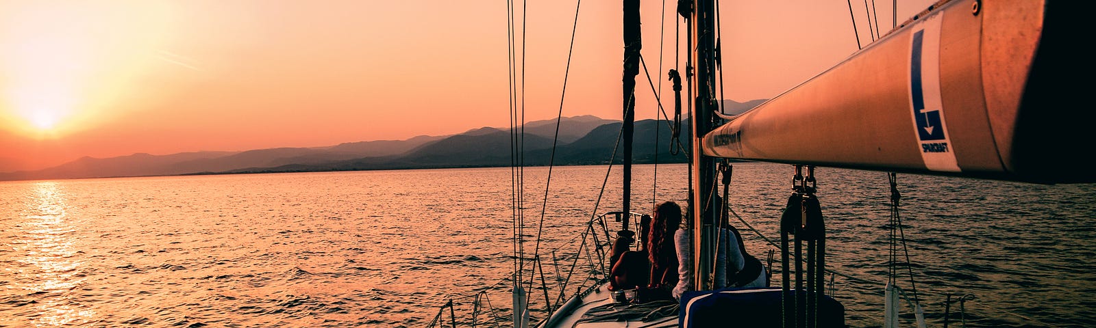 sailboat on ocean at sunset