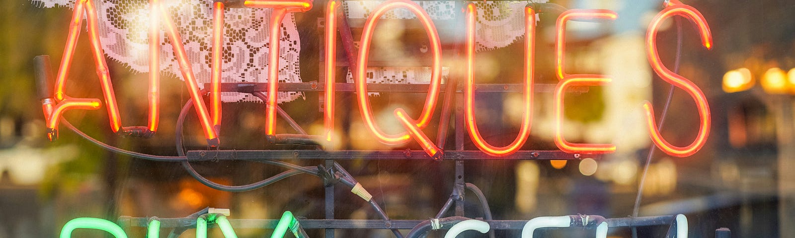 Neon sign saying antiques