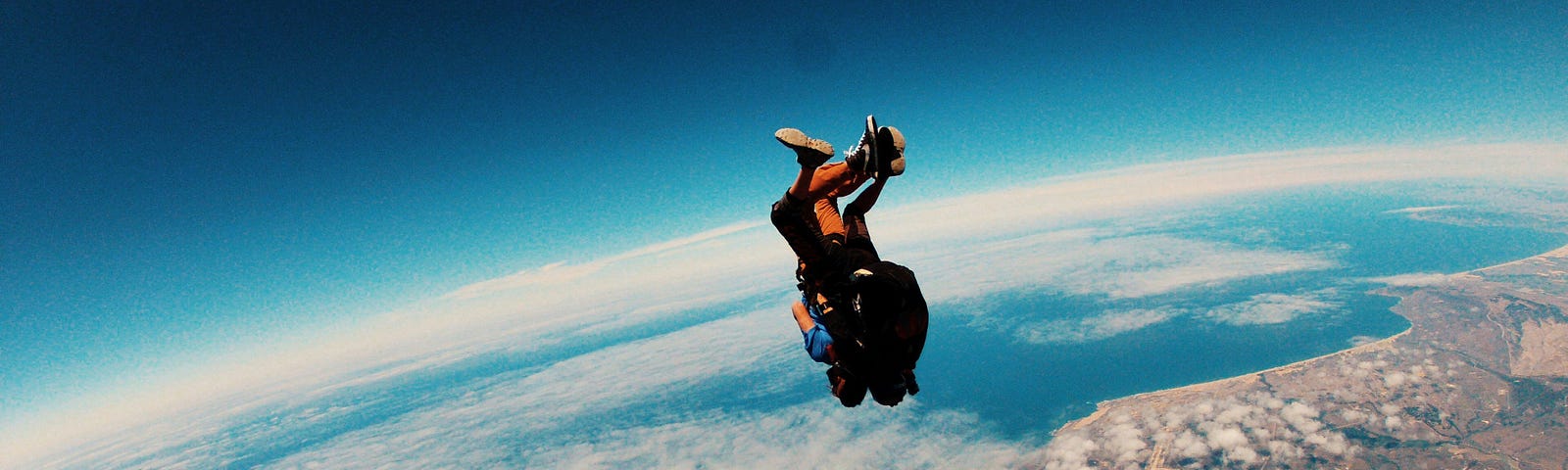 person leaping above the land.