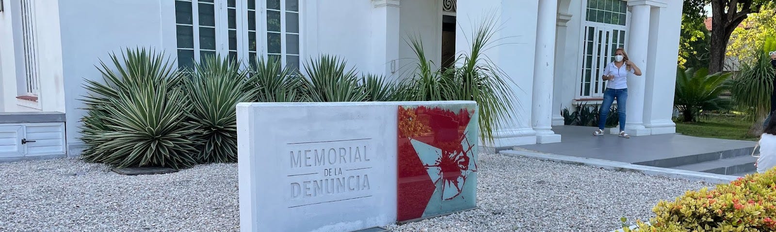 A sign outside of the museum that reads “Memorial de la Denuncia”