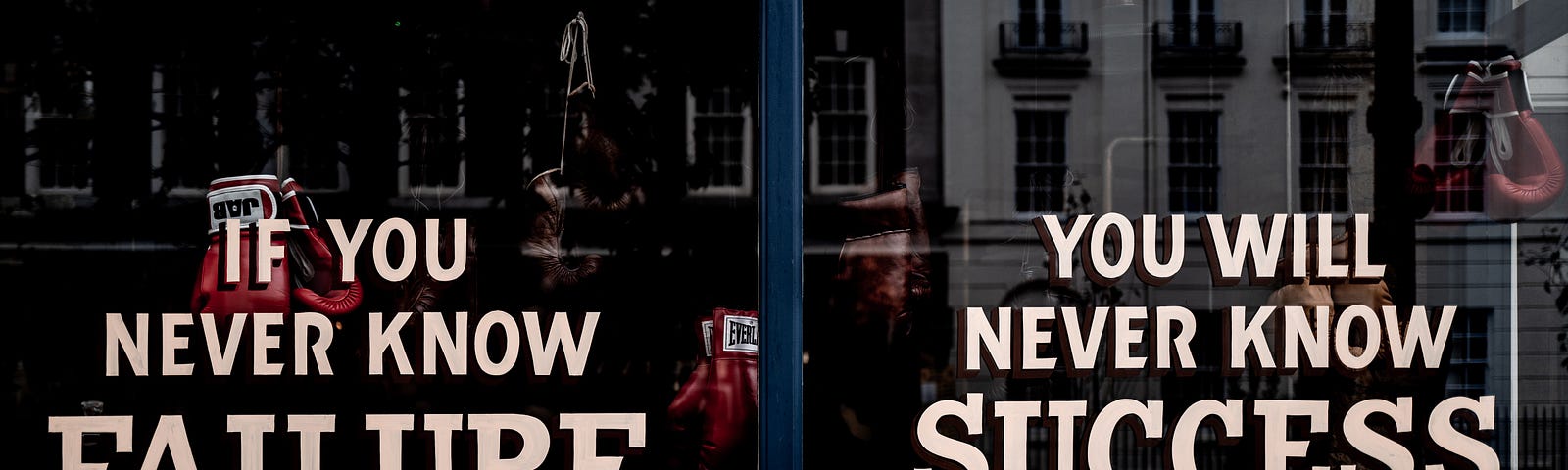 sign in the storefront window says: If you never know failure — You will neve know success