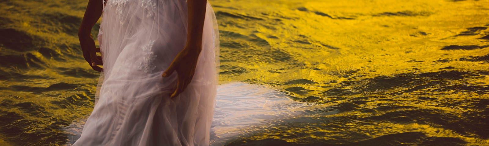 Woman becomes one with the waters as she walks through it