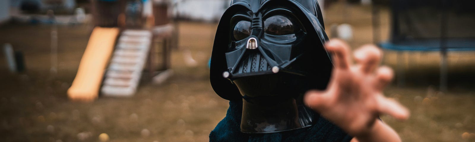 Boy in Darth Vader mask