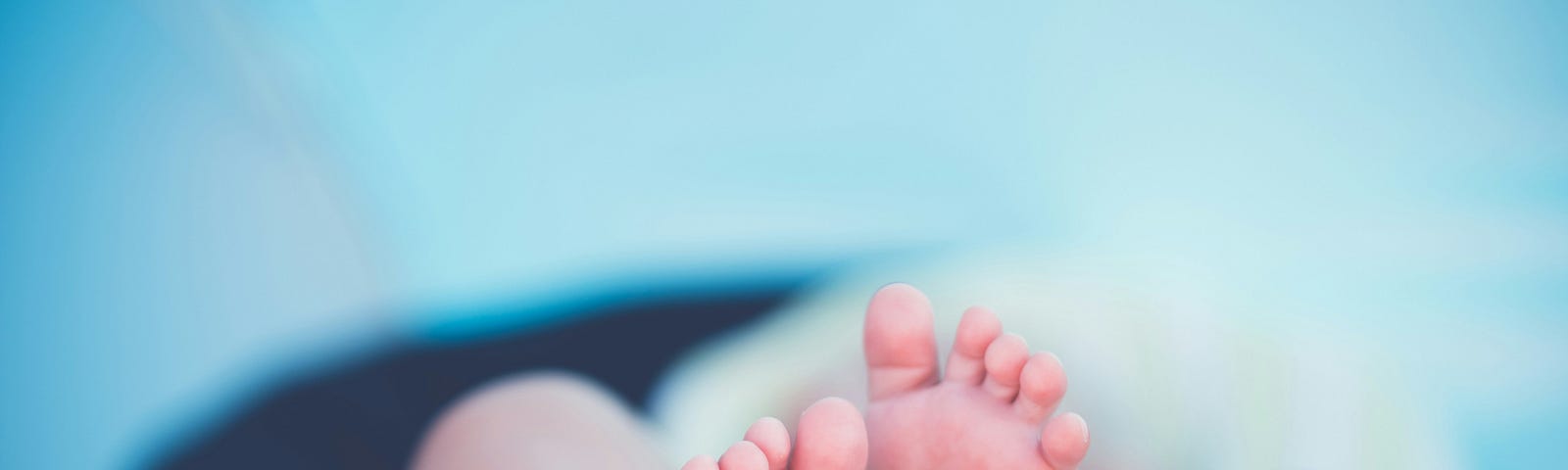 Photo by 🇸🇮 Janko Ferlič on Unsplash. Babies feet