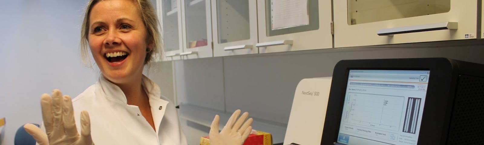 Noomi Gregersen with the sequencing machine that generated the first whole genomes from the Faroe Islands.