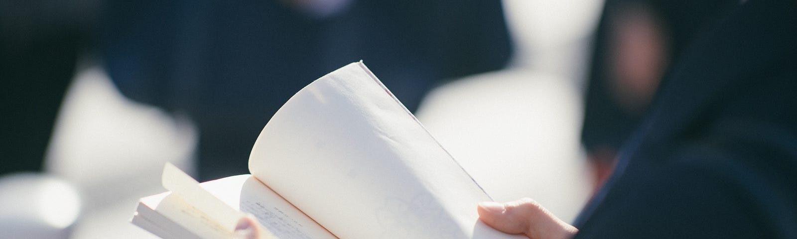 Woman looking at a book.