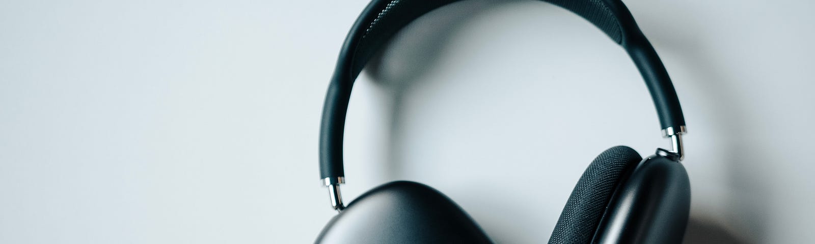 Space Grey AirPods Max on a white surface