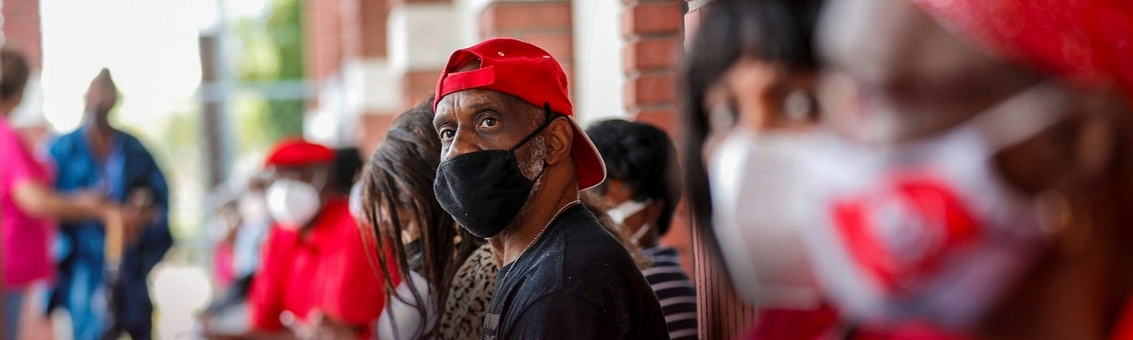 Members from historic African-American churches in the Tampa Bay Area wait in line to receive the Pfizer-BioNTech COVID-19 vaccine at the Greater Bethel Missionary Baptist Church in Tampa, Florida, February 14, 2021. Photo by Octavio Jones/Reuters