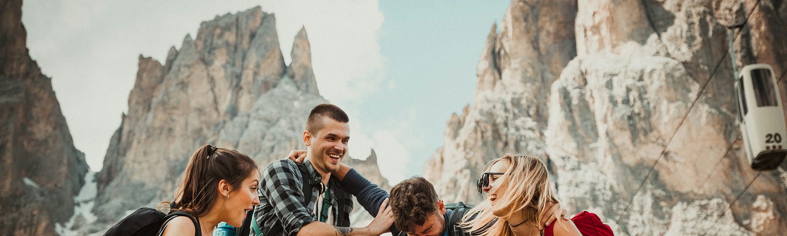 A group of people having fun and laughing while hiking.