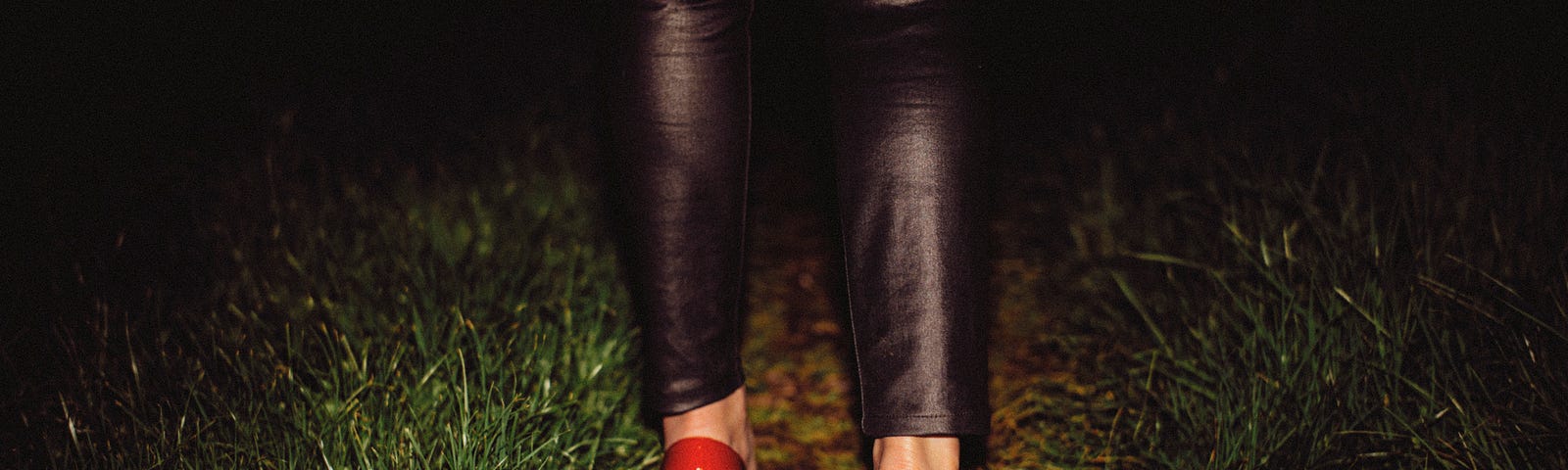 Red heels on a dark path