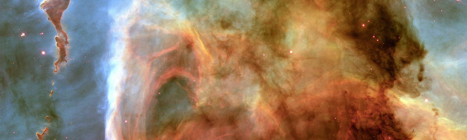 Cosmic gas clouds, or nebulae, with splashes of orange and blue