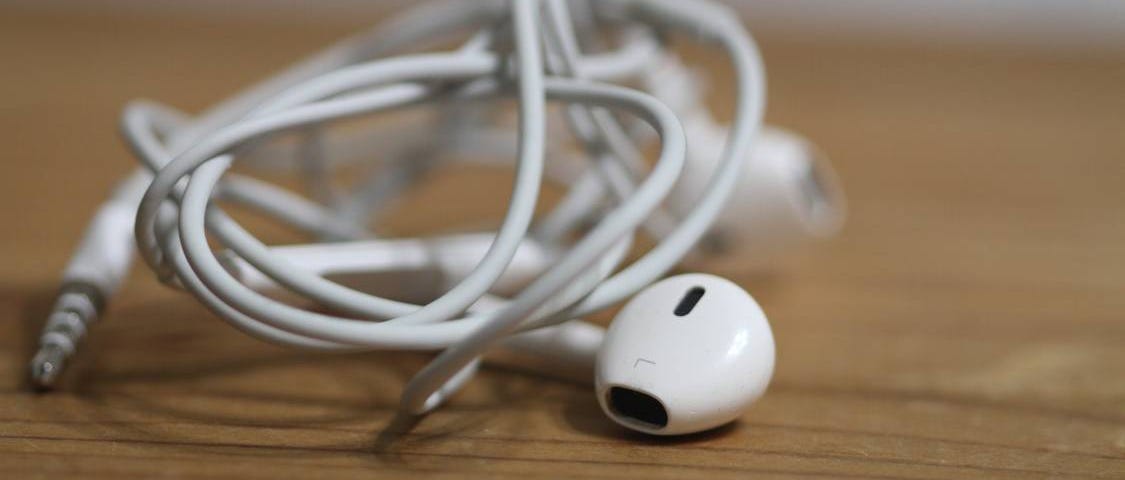 A pair of tangled apple earbuds