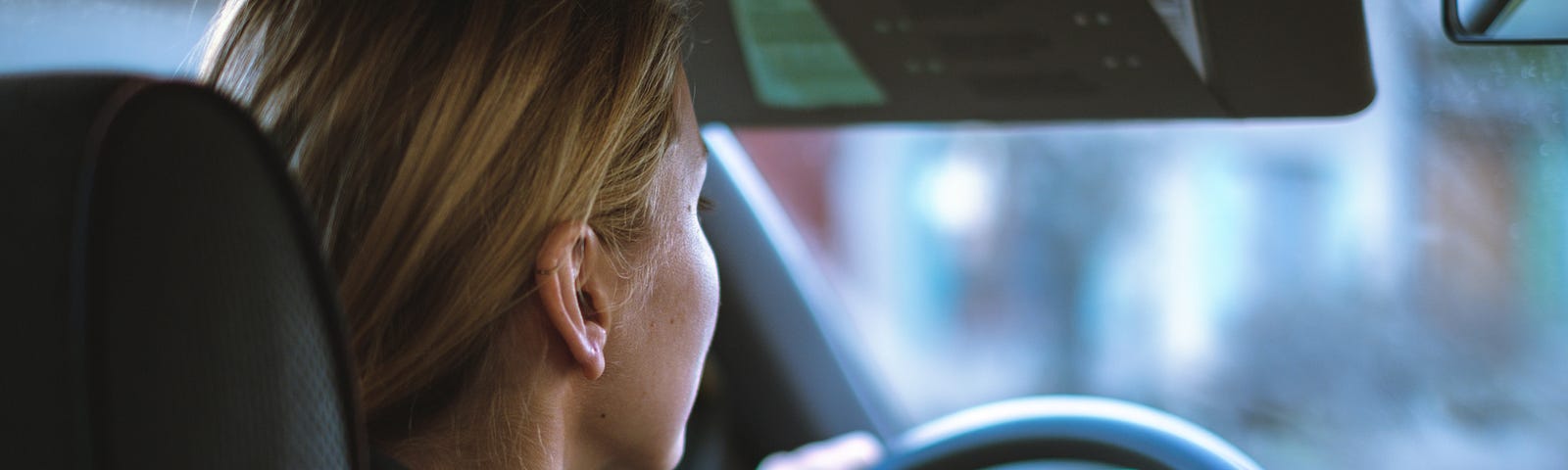 A lady driving a car