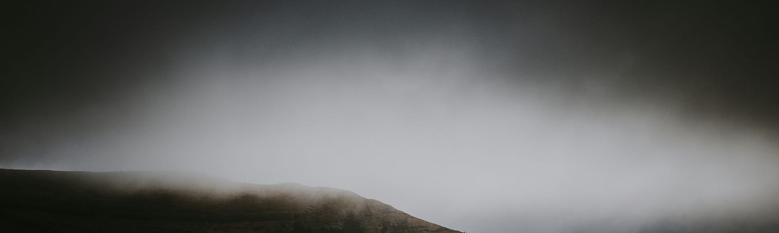 A valley surrounded by misty mountains