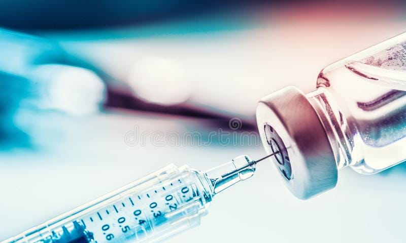 A syringe and ampule