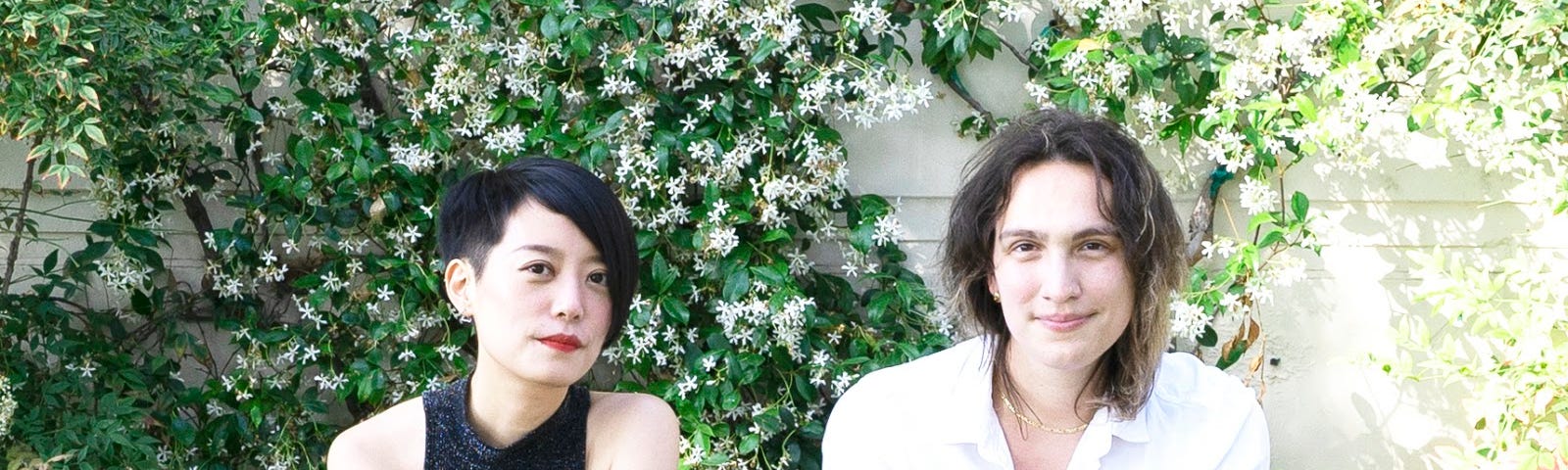 Qianqian and evelyn sitting together in a garden in Los Angeles.