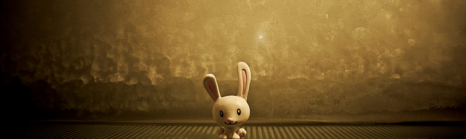 A white rabbit against a golden background