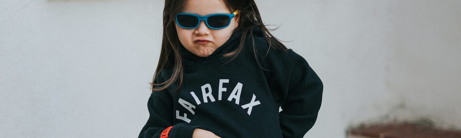 Little girl with sunglasses acting cool