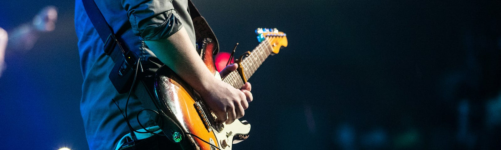 Man playing guitar on stage