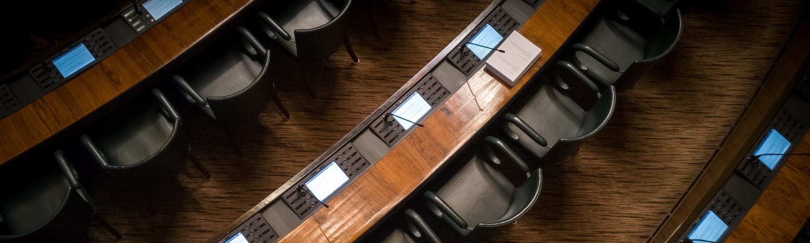 Empty chairs in legislative chamber