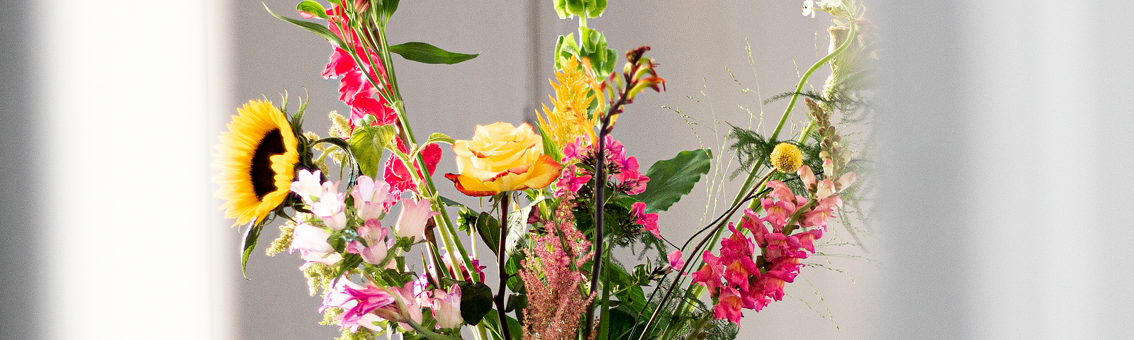 Vase with wild flowers in it.