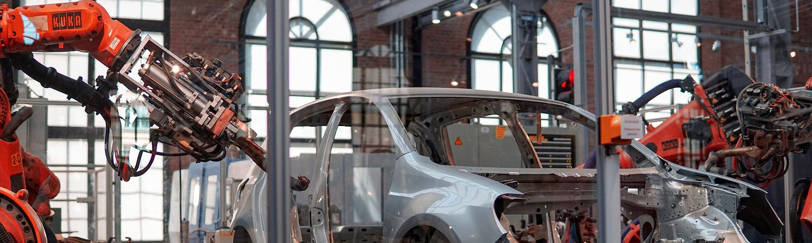 A car on the assembly line with robots