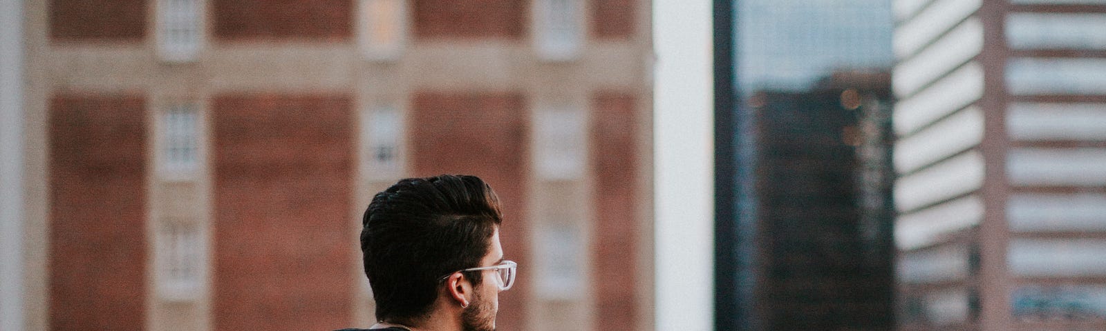 Young man sitting a lone thinking about reciprocation.